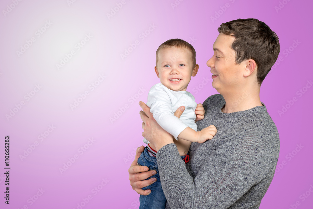 .Happy father holding his little son. .Happy father holding his little son.