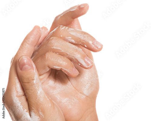 Female hands and moisturizing cream