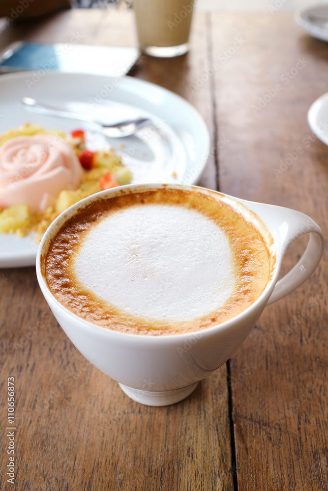 Coffee and white cake in cafe shop Coffee and white cake in cafe shop