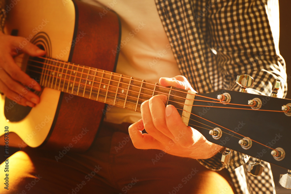 Fototapeta premium Man playing acoustic guitar