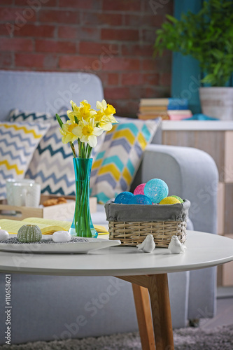 Design interior of living room with fresh narcissus flowers