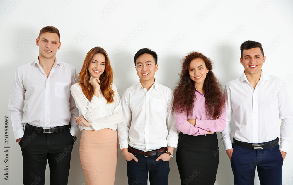 Portrait of young people against white wall background Portrait of young people against white wall background