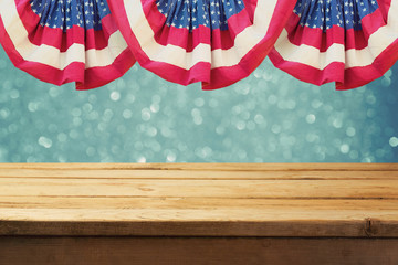 Independence day of America patriotic background with empty wooden table over USA flag. Memorial day background