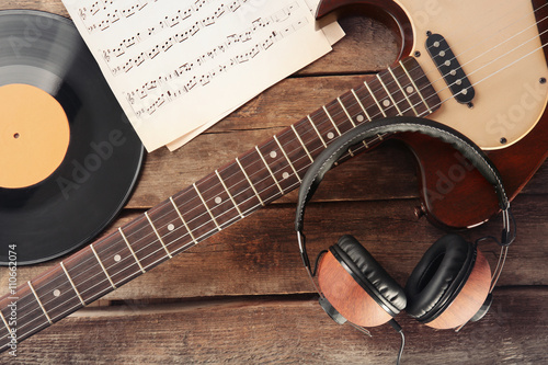 Guitar and headphones on wo...