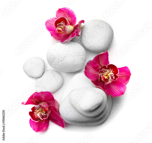 White spa stones and red orchid isolated on white