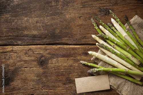 Fresh asparagus on wooden background