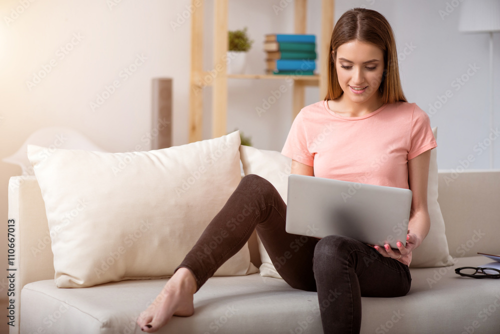 Pleasant woman resting on the couch Pleasant woman resting on the couch