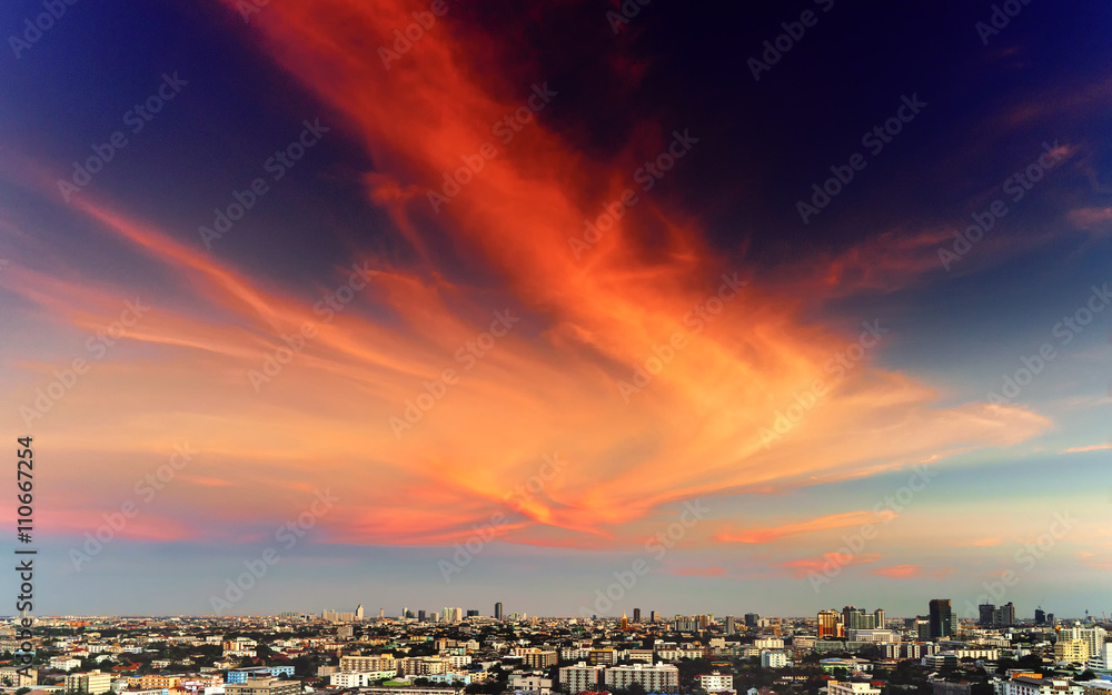 Bangkok Cityscape under blue sky with orange clouds in twilight