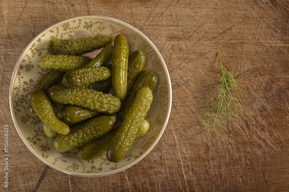 Marinated cucumbers or pickles on plate Marinated cucumbers or pickles on plate