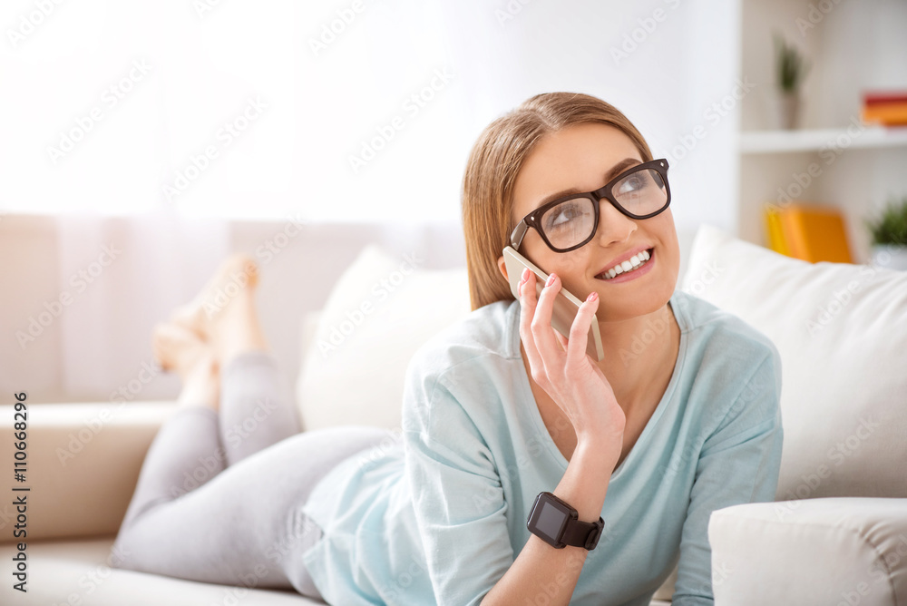 Positive woman talking on cell phone Positive woman talking on cell phone