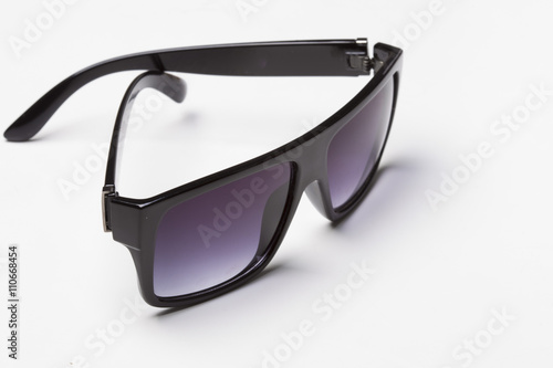 Black classic sunglasses on a white background