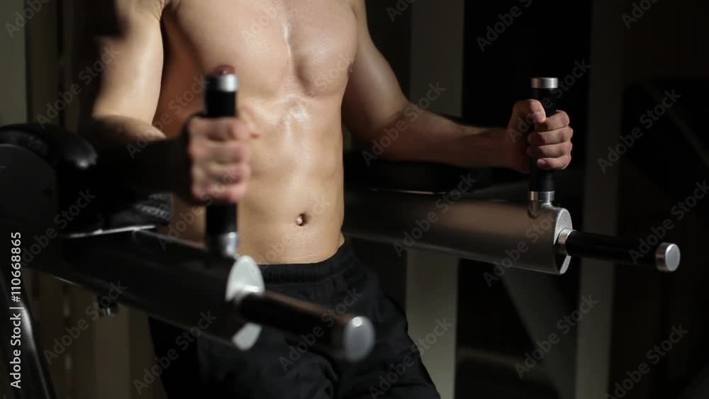 Guy in the gym. Makes abdominal exercises. Guy in the gym. Makes abdominal exercises.