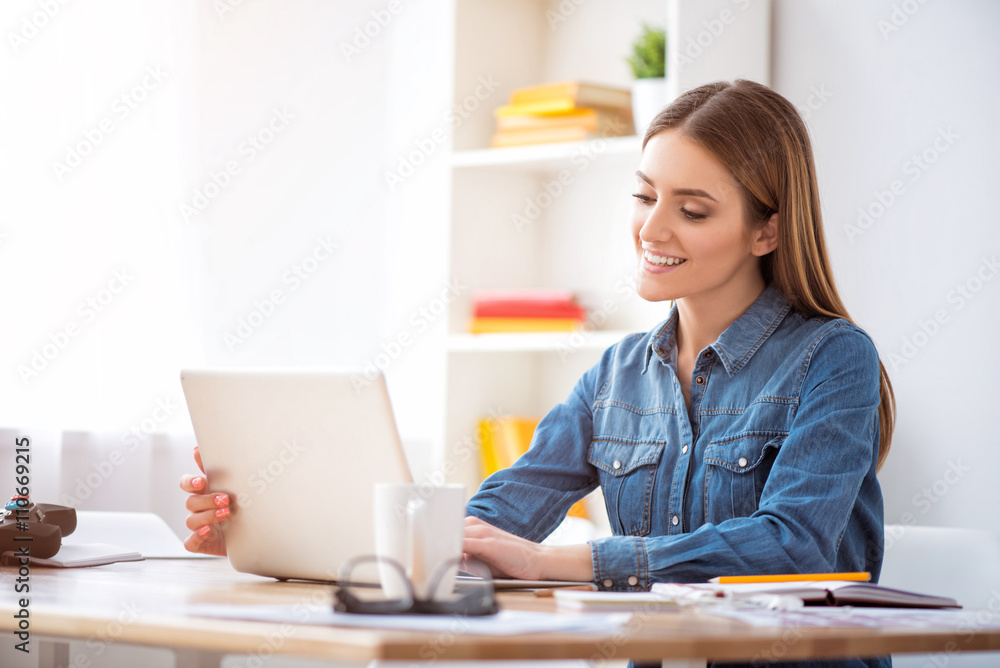 Cheerful woman sitting at the table Cheerful woman sitting at the table