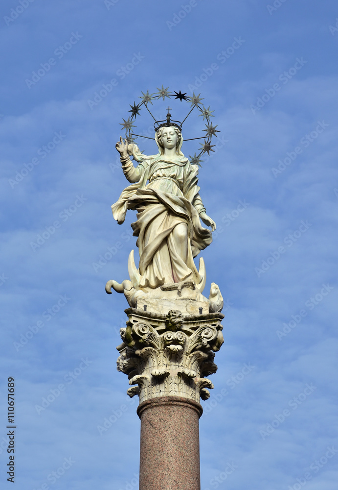 Mary of the Stars. Beautiful statue of Virgin Mary crush dragon and crescent in the historic center of Lucca, made by the artist Giovanni Lazzoni in 1687