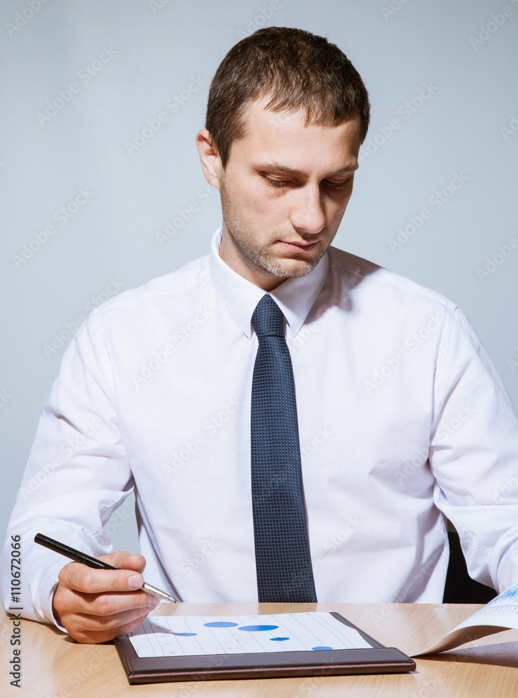 Businessman examining documents Businessman examining documents
