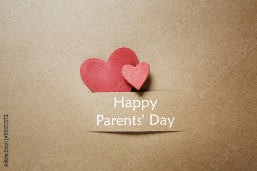 Parents day message with handmade red small hearts photo