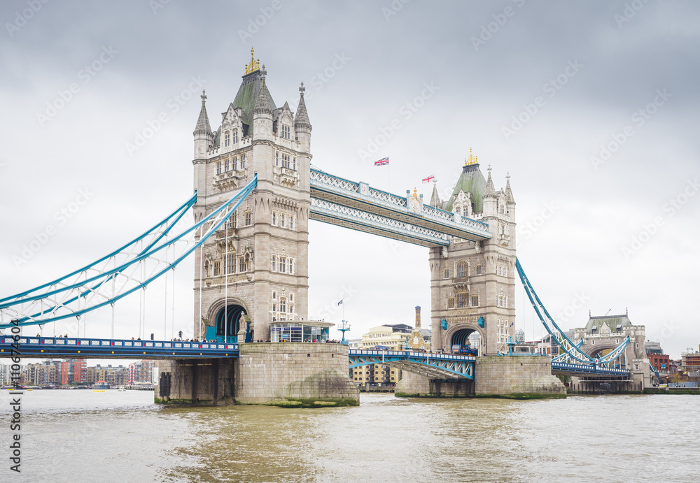 Obraz premium Tower Bridge in London, the UK. Sunset with beautiful clouds. Drawbridge opening. One of English symbols..
