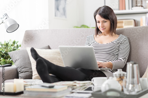 Woman using a laptop at home