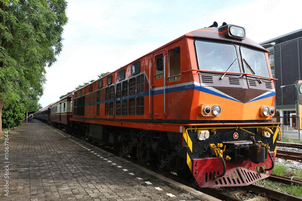orange train on railway station wait to travel orange train on railway station wait to travel
