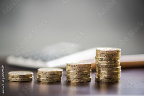 Pound coin stacks, growth concept