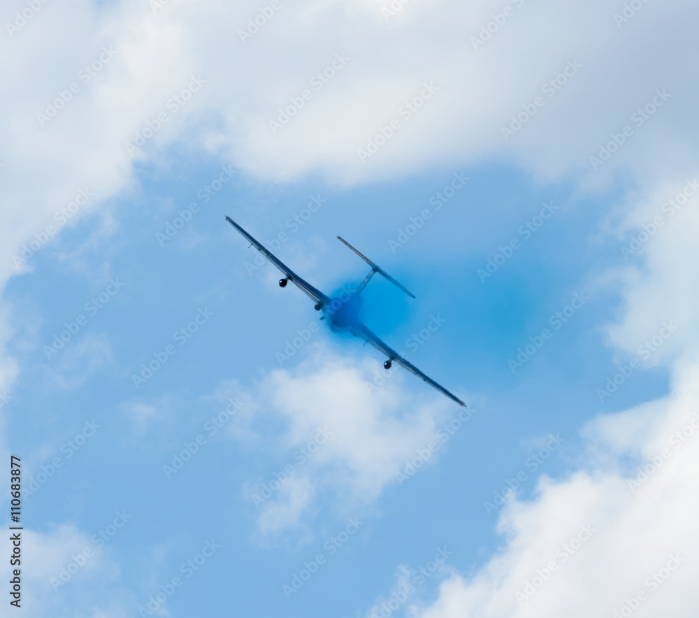 plane with colorful trail in the sky at Kharkiv airshow