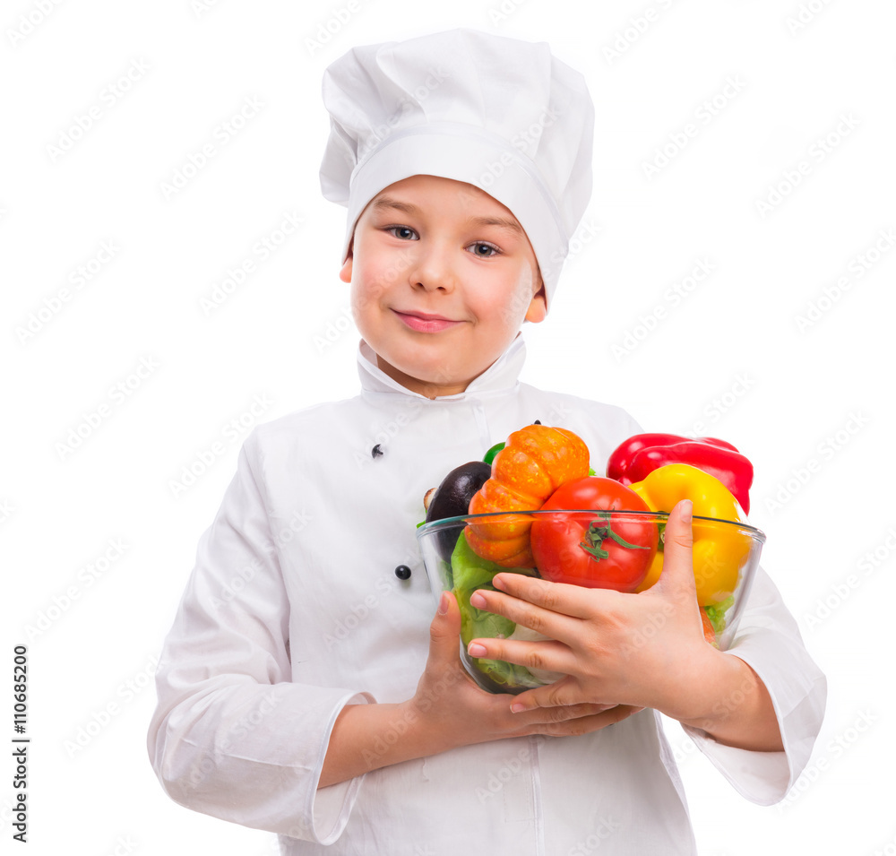 funny little boy-cook in uniform holding bowl with vegetables in hands isollated on white background funny little boy-cook in uniform holding bowl with vegetables in hands isollated on white background