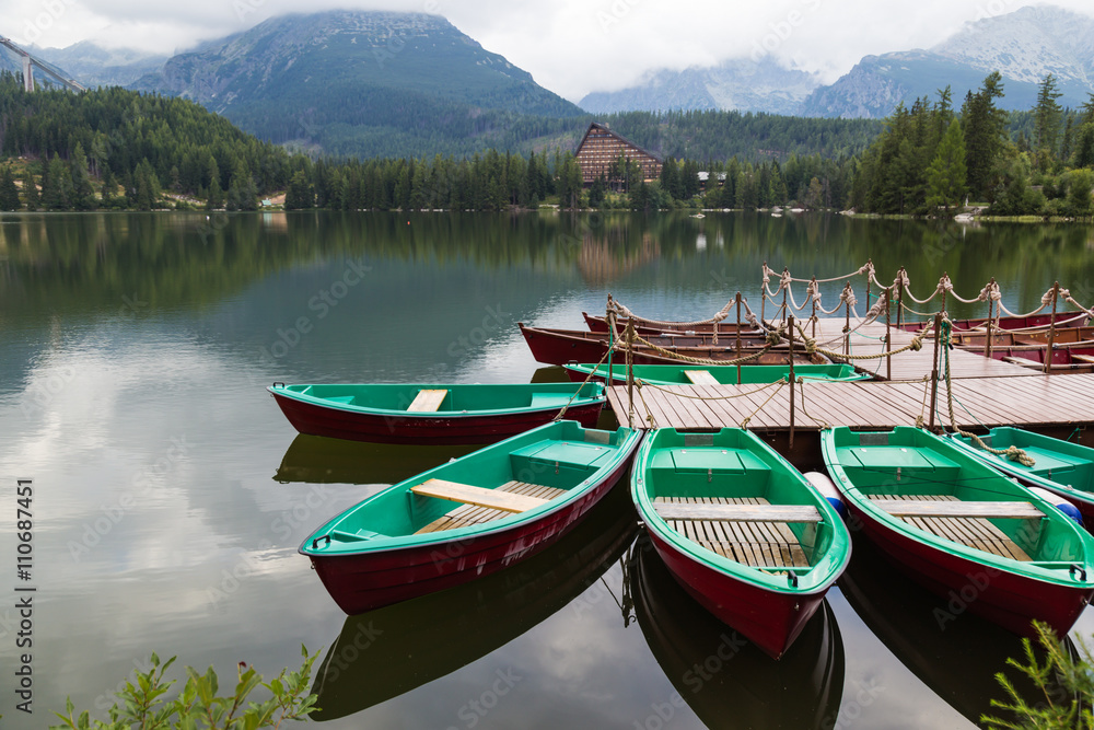 Colorful wooden boat on  mountain lake .