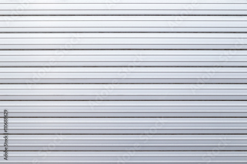 Security roller door or garage door background - corrugated metal sheet.