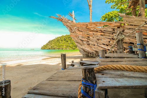 Old wooden boat on the beach photo