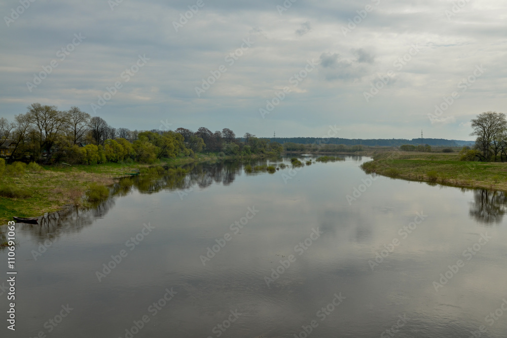 wooded banks of flooded Dzisna river in spring
Dzisna, Belarus