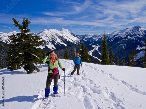 Two Women Snowshoeing in Mountains. Yago Peak, Coquihalla Summit Recreation Area near Hope, British Columbia, Canada. 