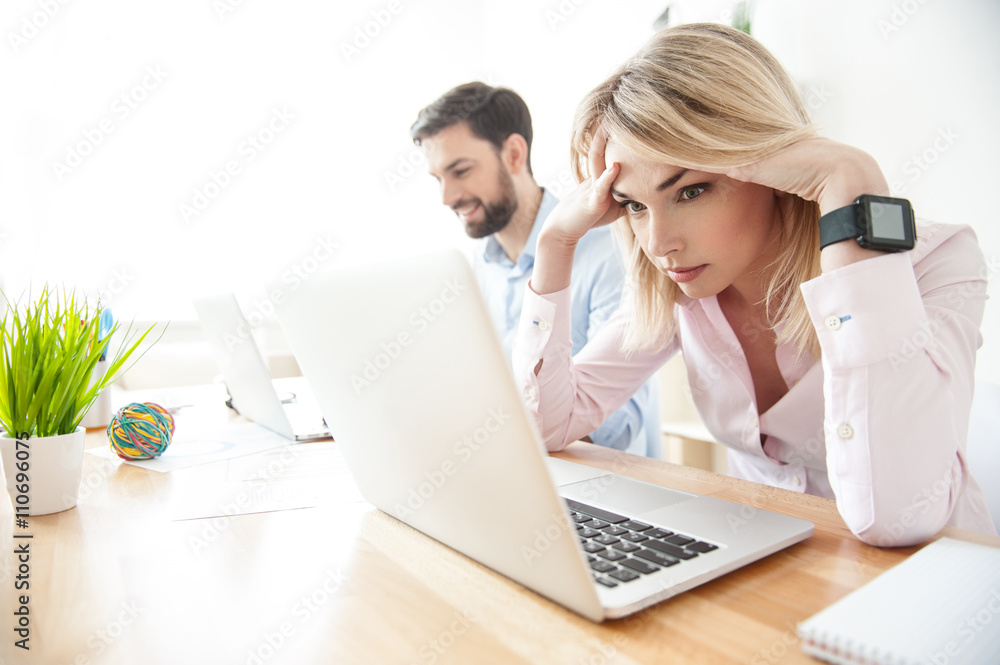 Attractive blond woman is tired from work Attractive blond woman is tired from work