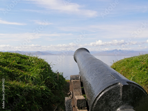 the Kamchatka Peninsula. old cannon on the shore of the Avacha Bay near Petropavlovsk-Kamchatsky. Old cannon that is targeted towards the sea for the defense. powerful old cannon. ancient weapons.
