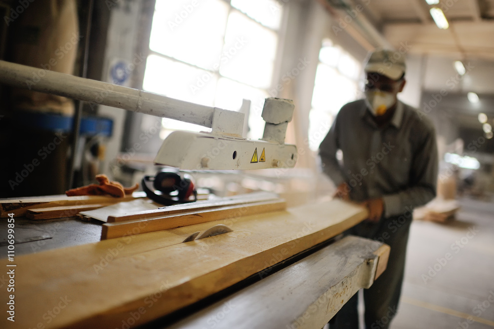 carpenter saws a board a circular saw carpenter saws a board a circular saw