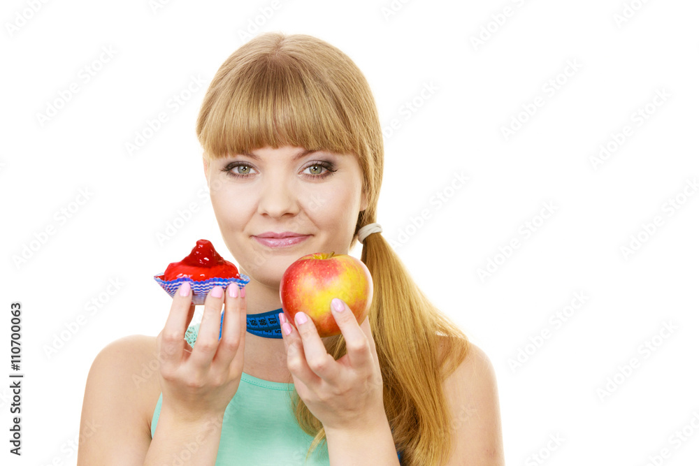 Woman choosing fruit or cake make dietary choice Woman choosing fruit or cake make dietary choice