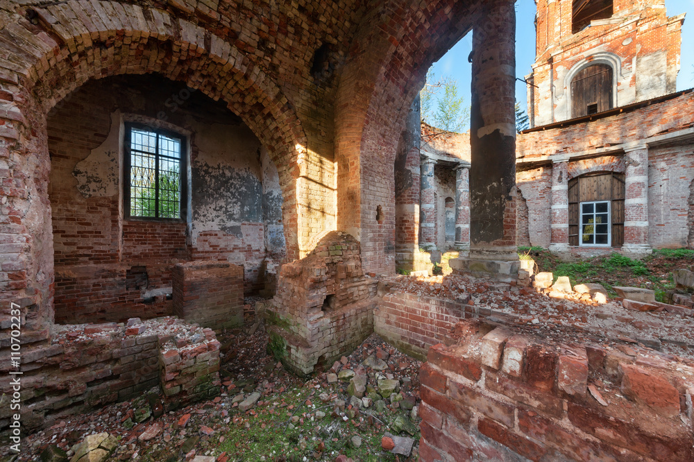The brick ruins of the interior of an abandoned temple.