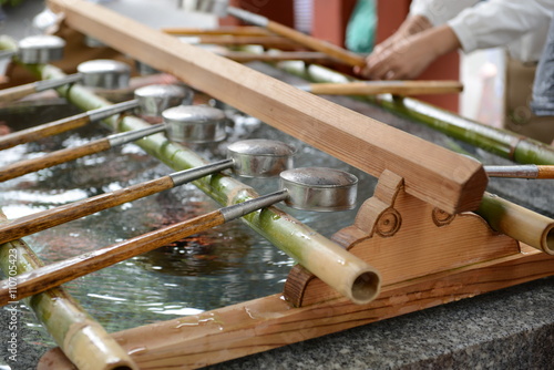 Water dipper in front of Yutoku Inari Shrine, Saga Japan To wash hands before enter shrines. photo