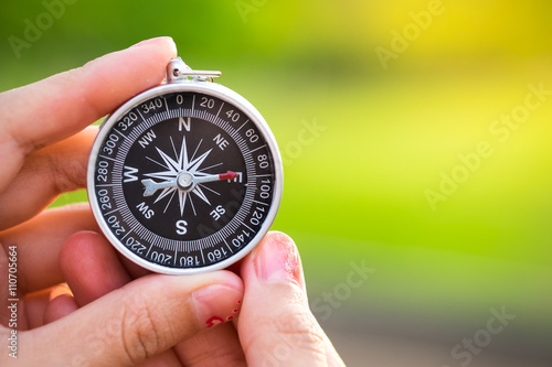 Compass in the hand. conceptual of global travel , tourism and exploration, with copyspace
