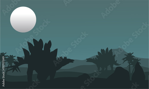 stegosaurus and moon silhouette