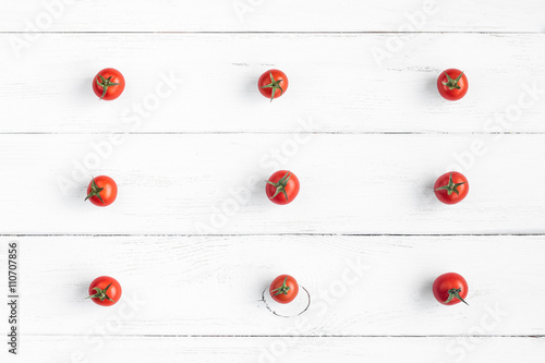 cherry tomatoes on wooden white background