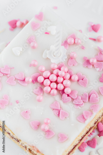 glazed cake decorated with hearts