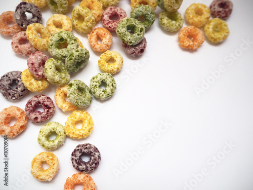 Colorful fruit flavored cereal with space for putting text, selective focus