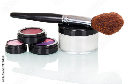 Set professional cosmetics and makeup brush isolated on white background.
