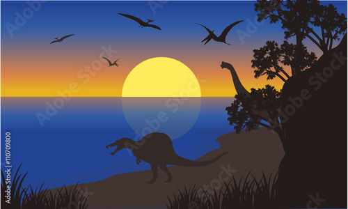 Silhouette of spinosaurus and pterodactyl