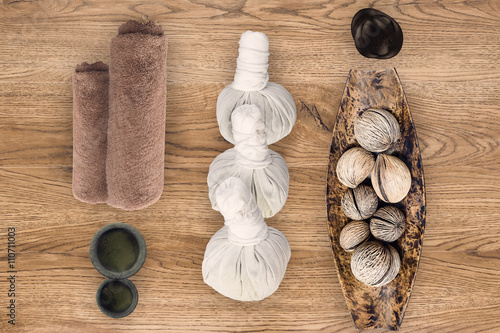 spa and massage accessories on wooden background photo