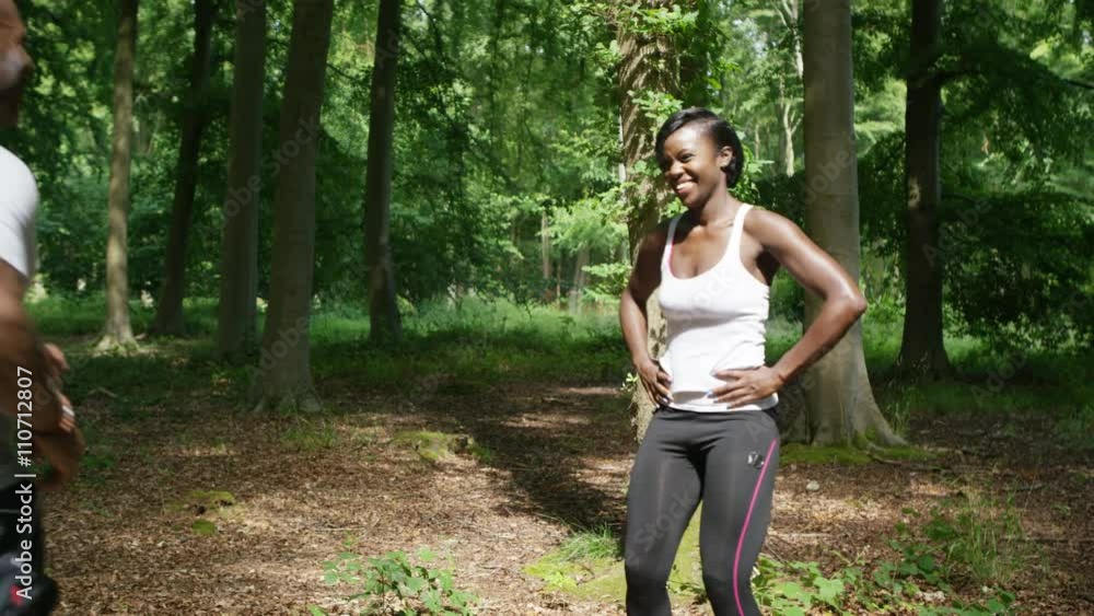 Attractive African American couple going for a run in the woods Attractive African American couple going for a run in the woods