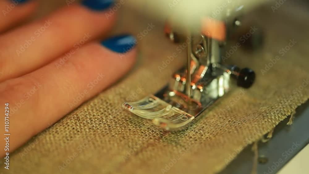 Work on the sewing machine . processing the fabric edge overlock stitch linen Work on the sewing machine . processing the fabric edge overlock stitch linen