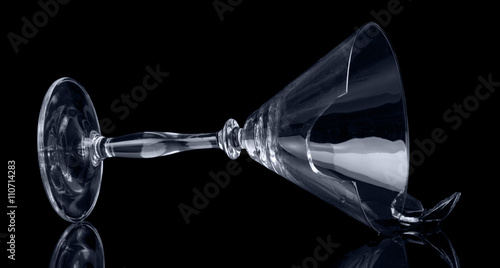 Broken glass tumbler cocktail isolated on  black background.