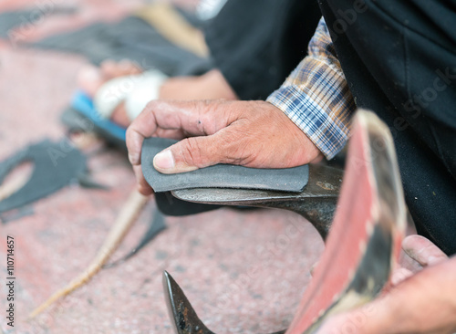 shoesmaker changing shoes soles  