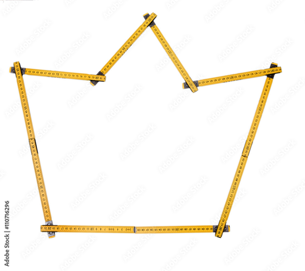 Folding ruler isolated, yellow carpenter's rule with centimeters numbers.